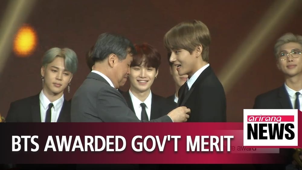 BTS receiving the cultural medal