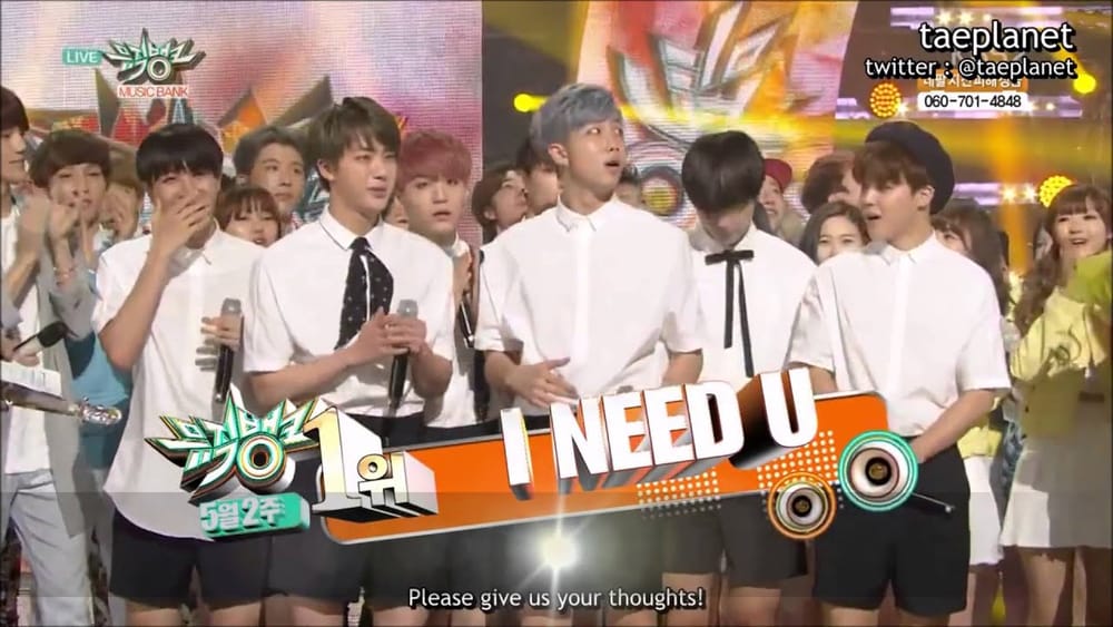 BTS members celebrating their first win