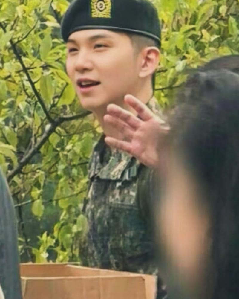 Suga before beginning alternative military service